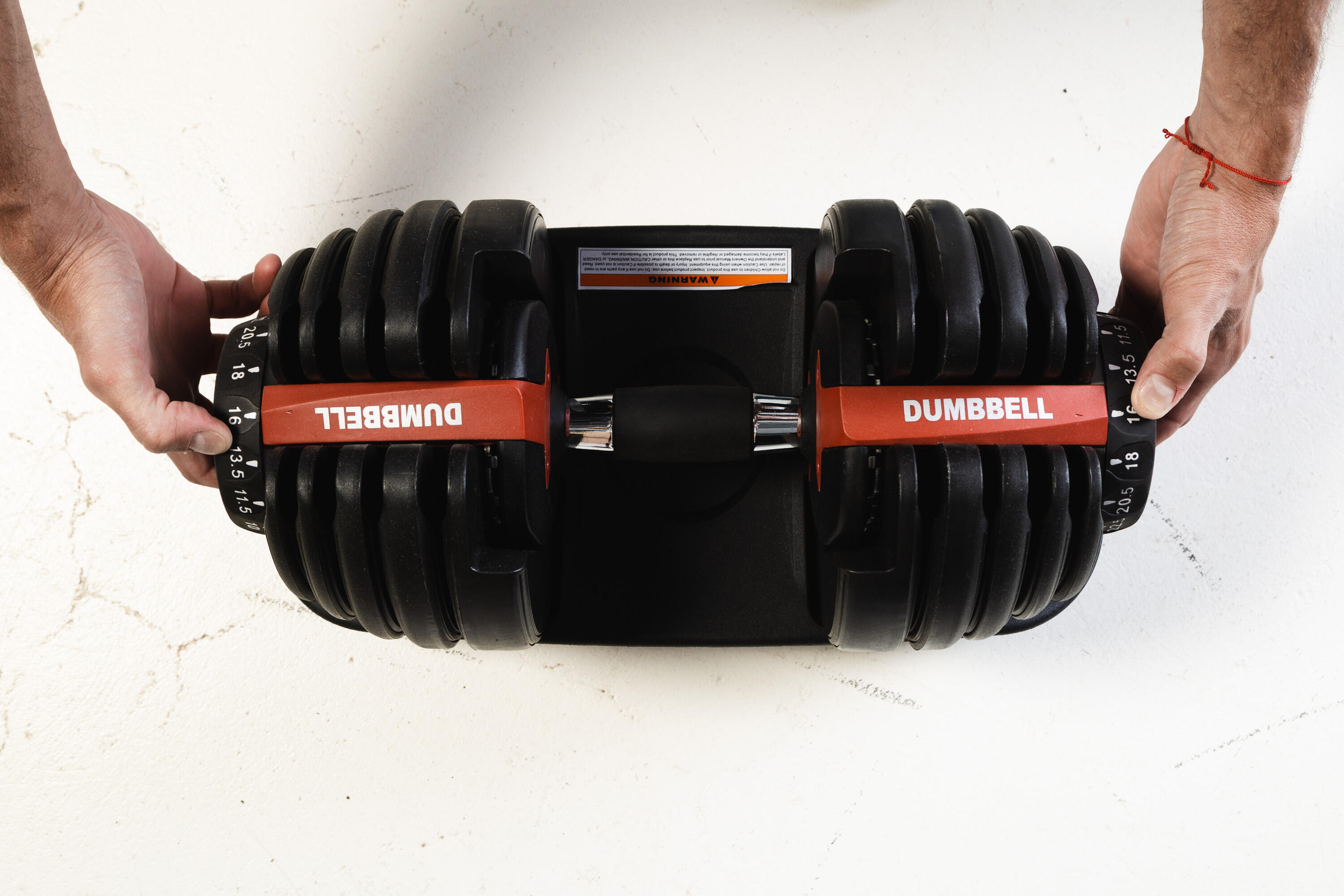 Adjustable dumbbells for home gyms