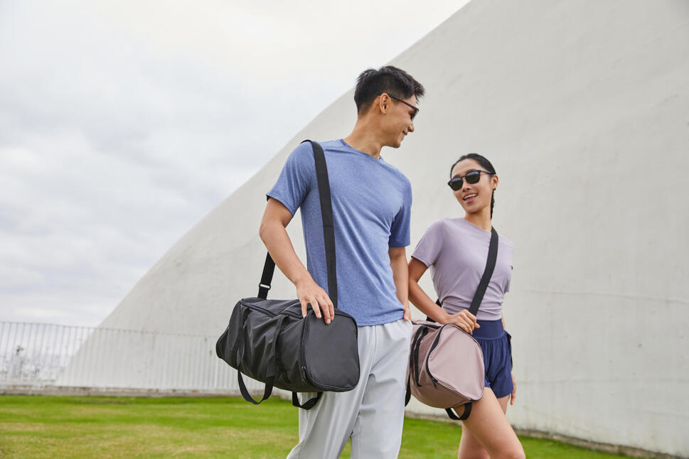 Person carrying a gym bag to a workout