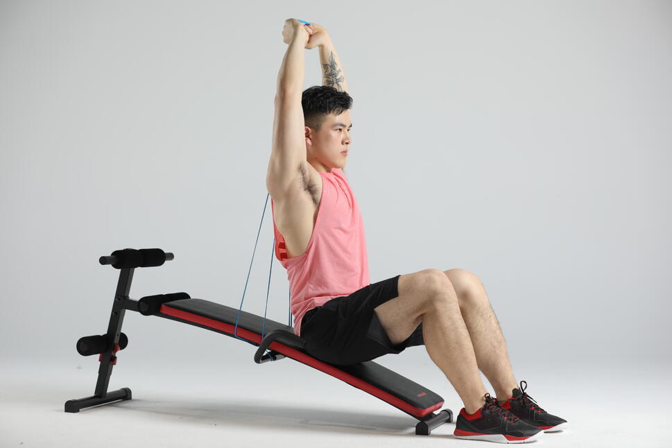 Man training on a gym bench at home