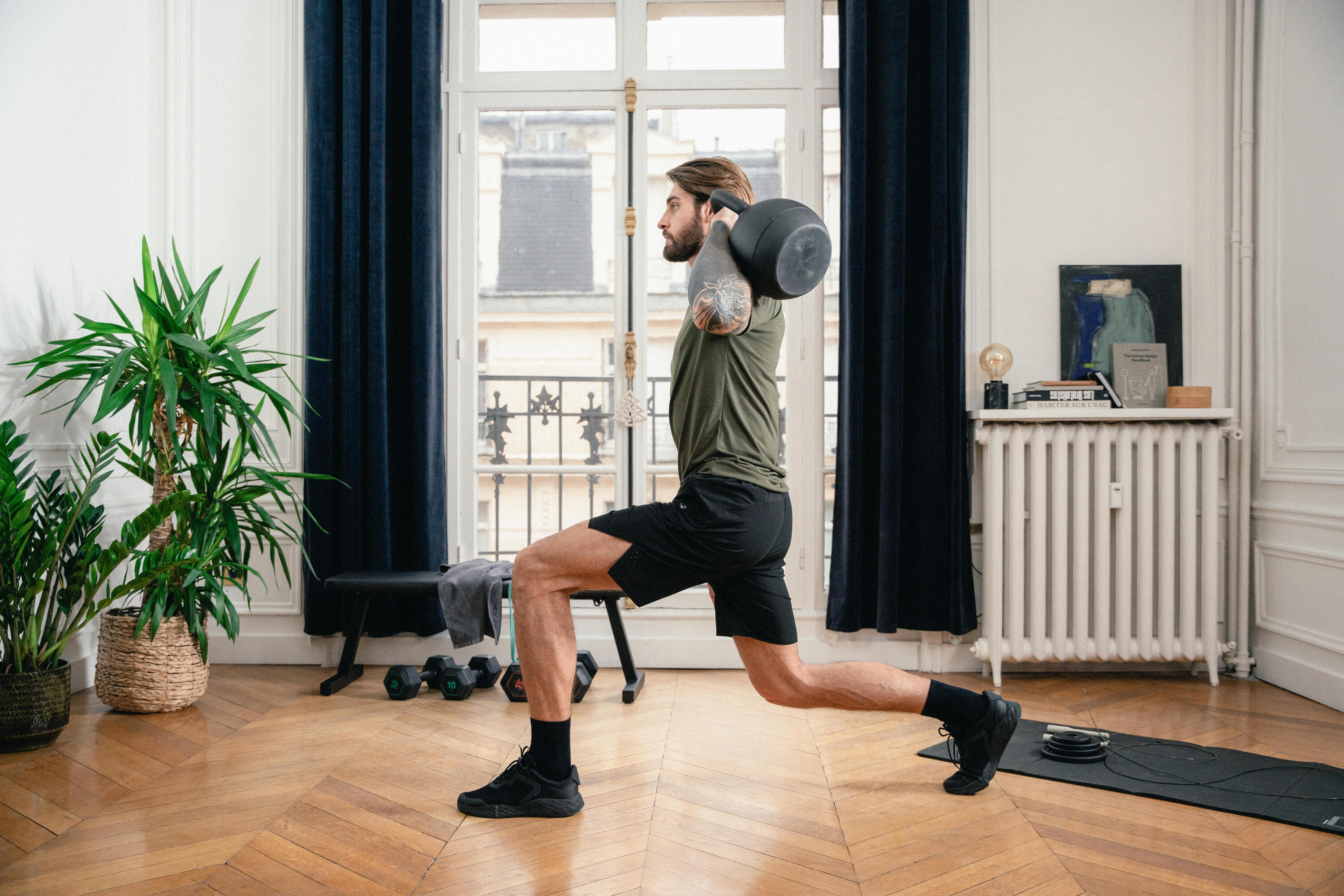 Woman training with a kettlebell at home
