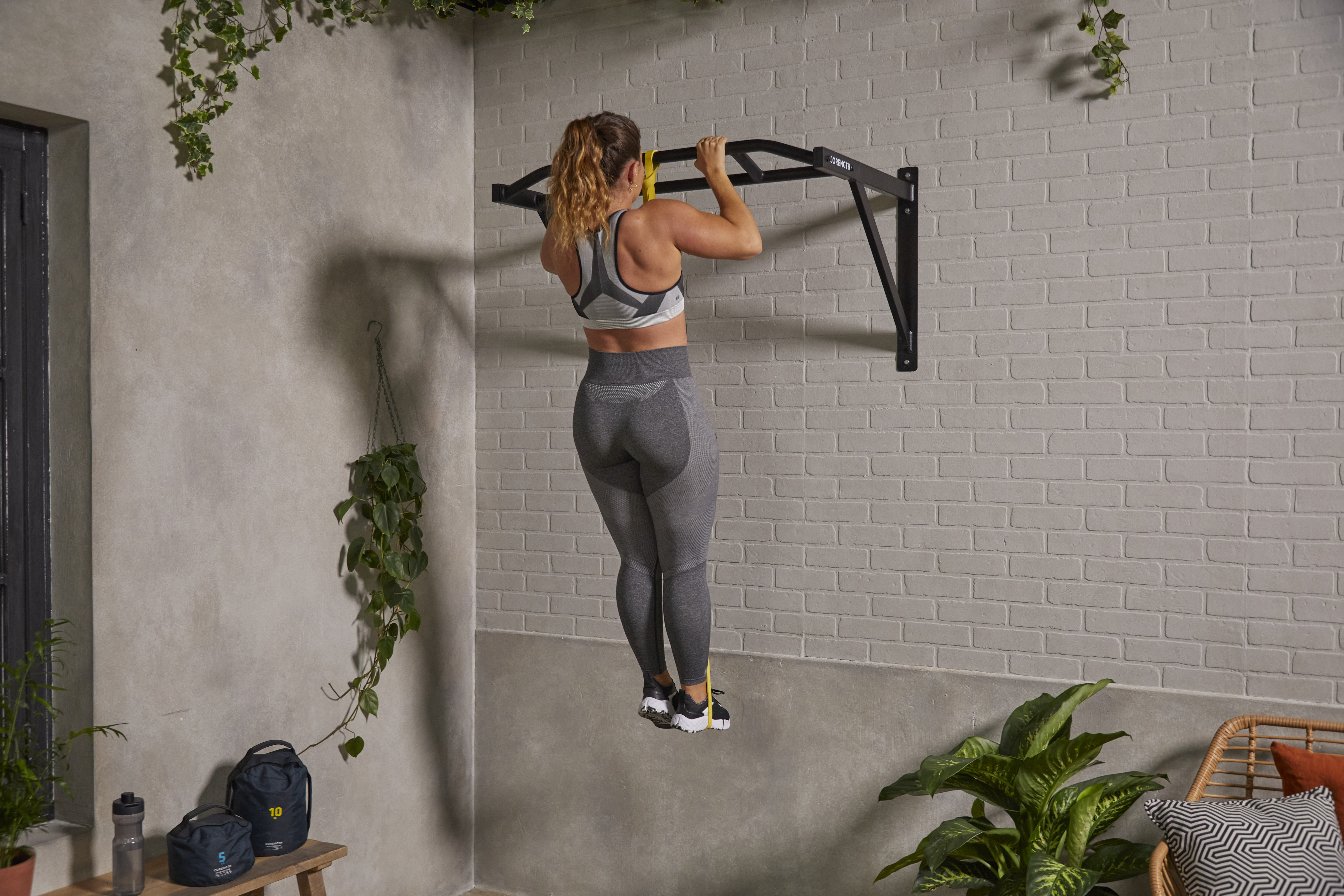 Person doing pull ups at home