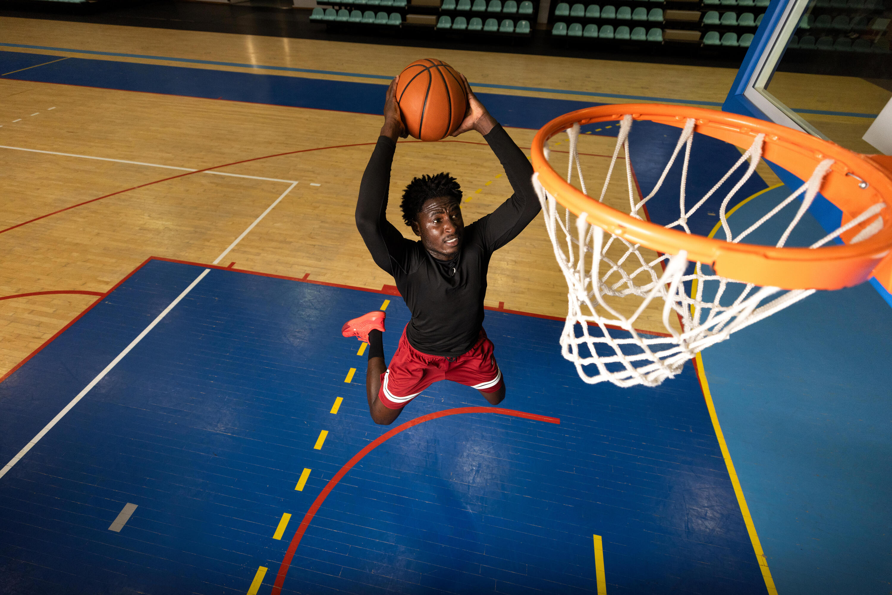 Player dribbling a basketball on a court