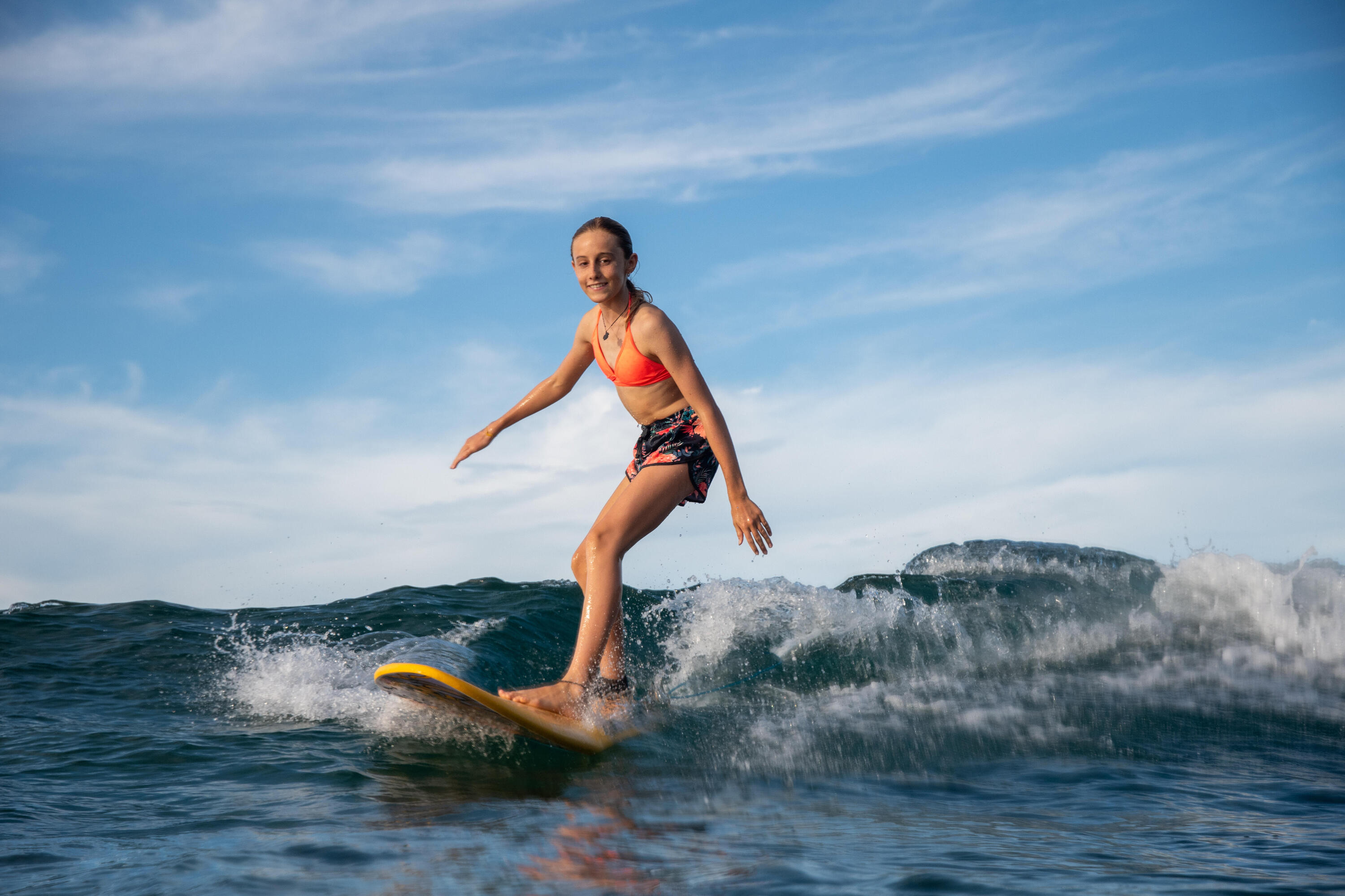 Person wearing board shorts at the beach