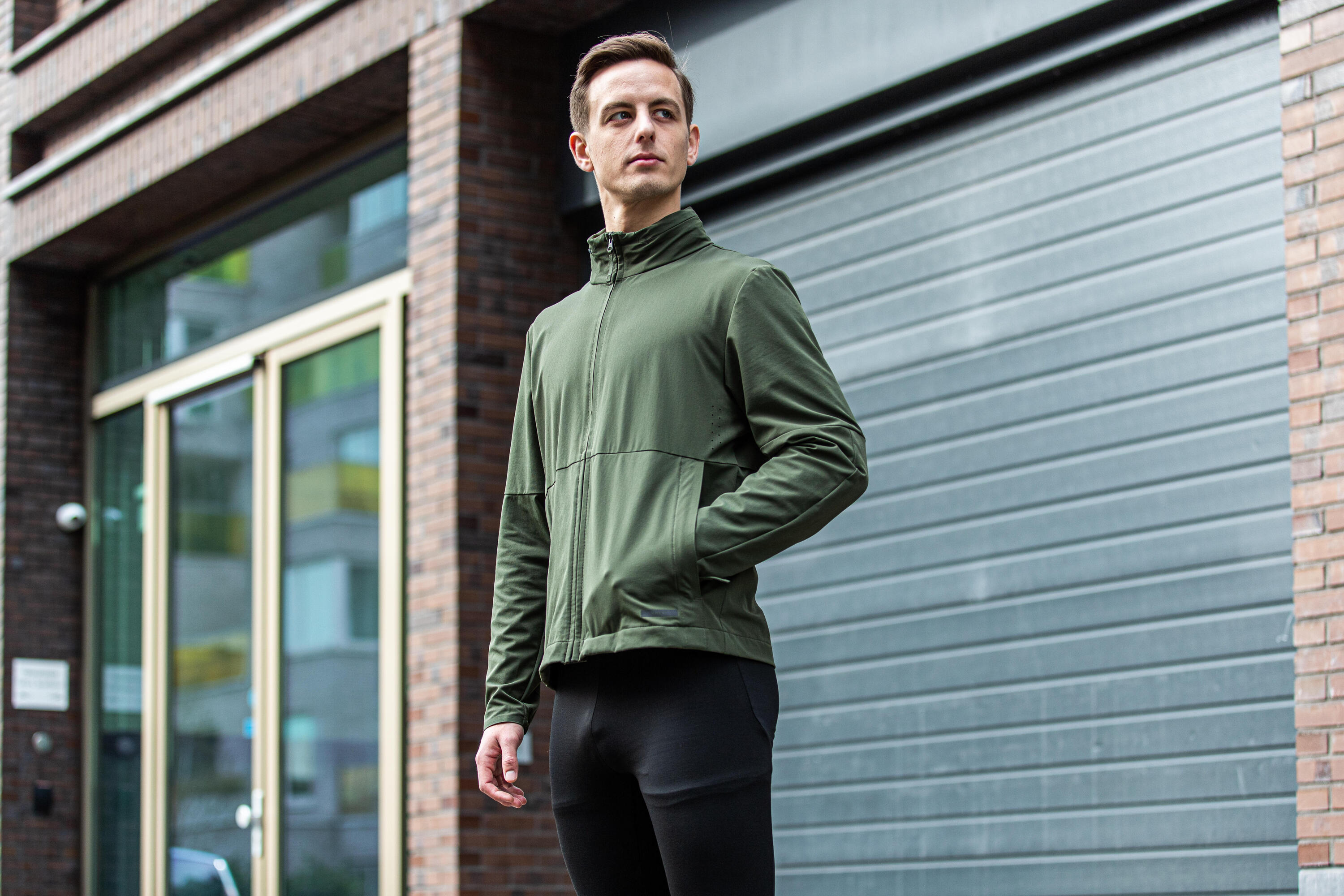 Person wearing a windbreaker jacket outdoors