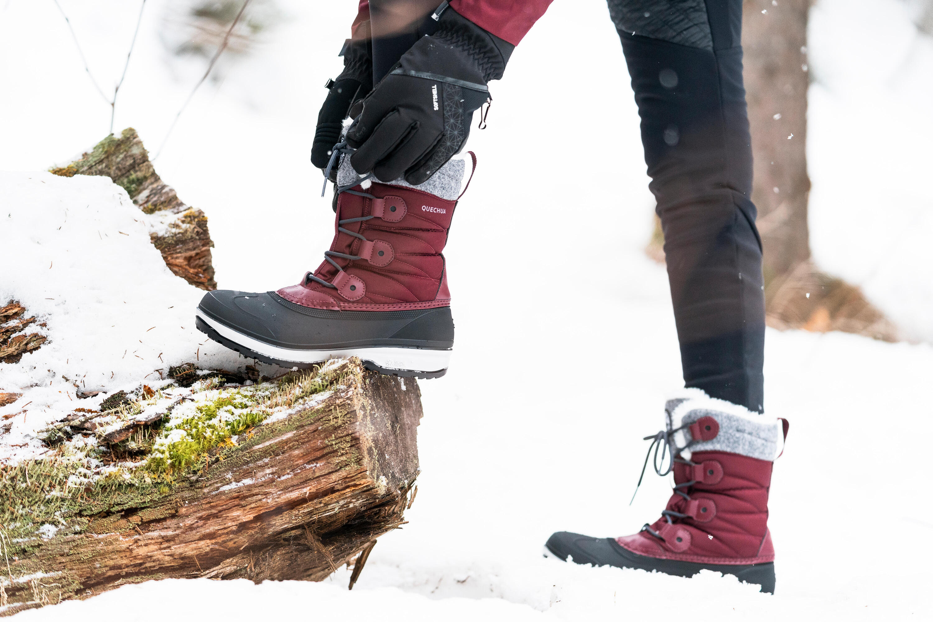 Close-up of women's hiking boots on rocky ground