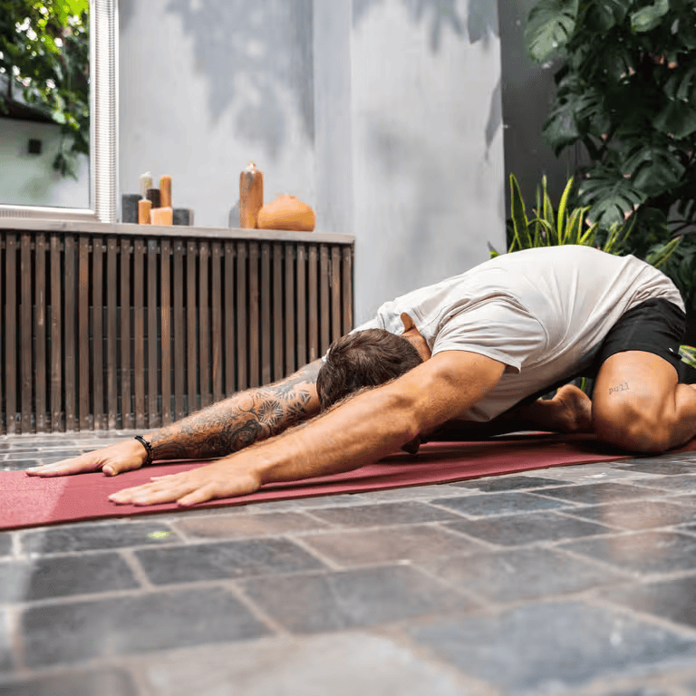 Man streching on a yoga mat
